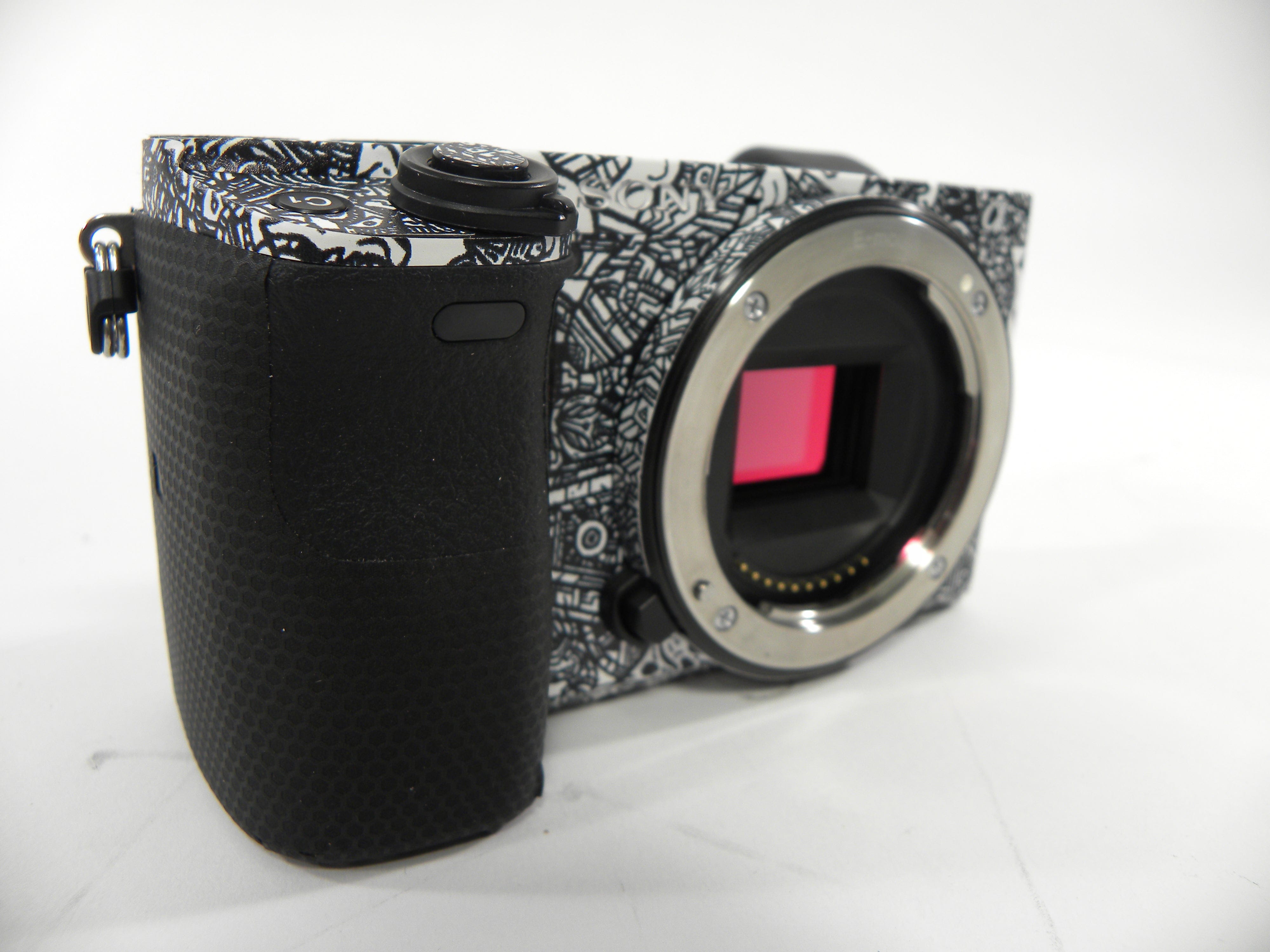 Sony a6400 24.2mp Mirrorless Digital camera Body Only w/Skin Shutter Ct. 5,061