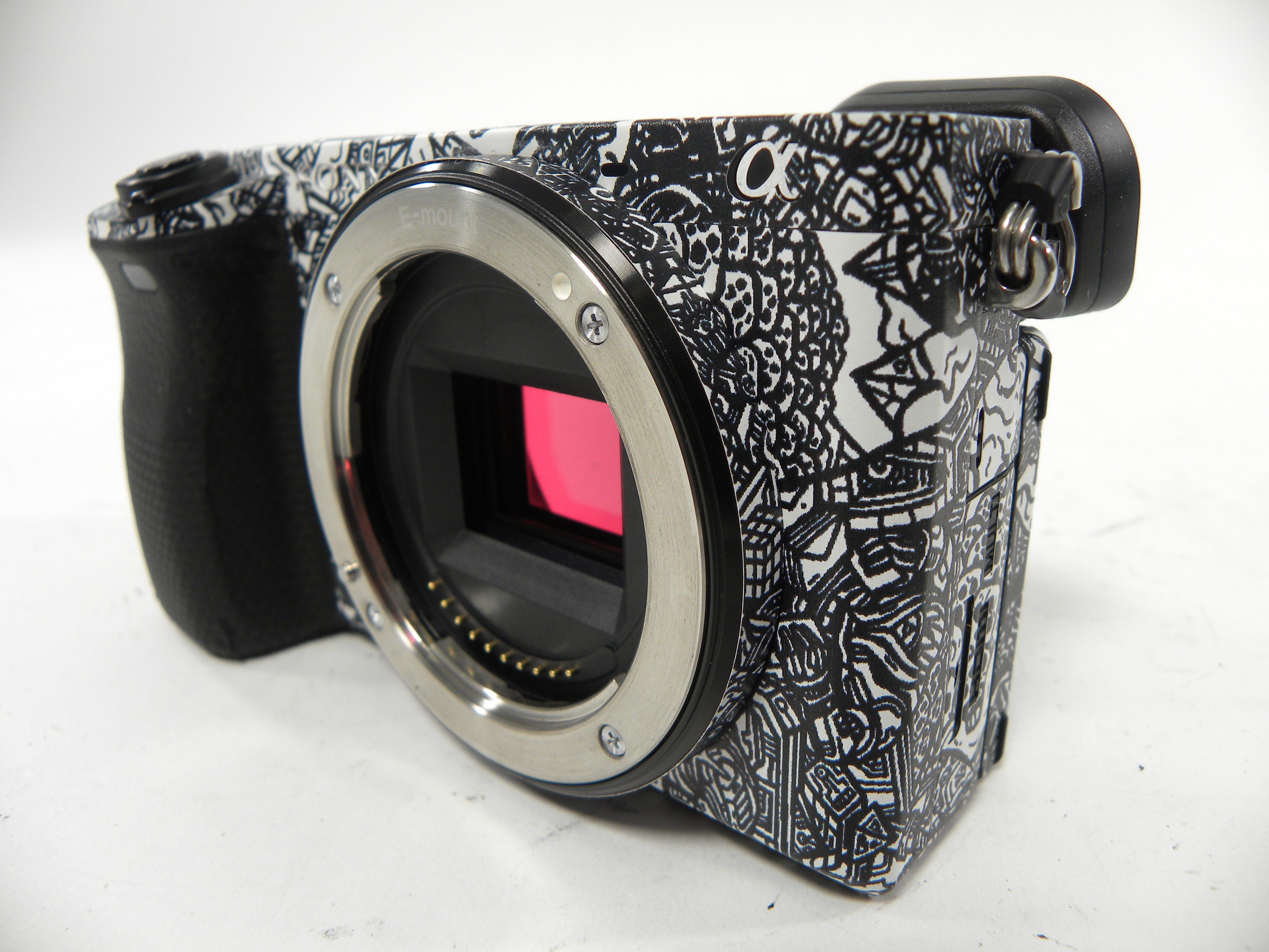 Sony a6400 24.2mp Mirrorless Digital camera Body Only w/Skin Shutter Ct. 5,061