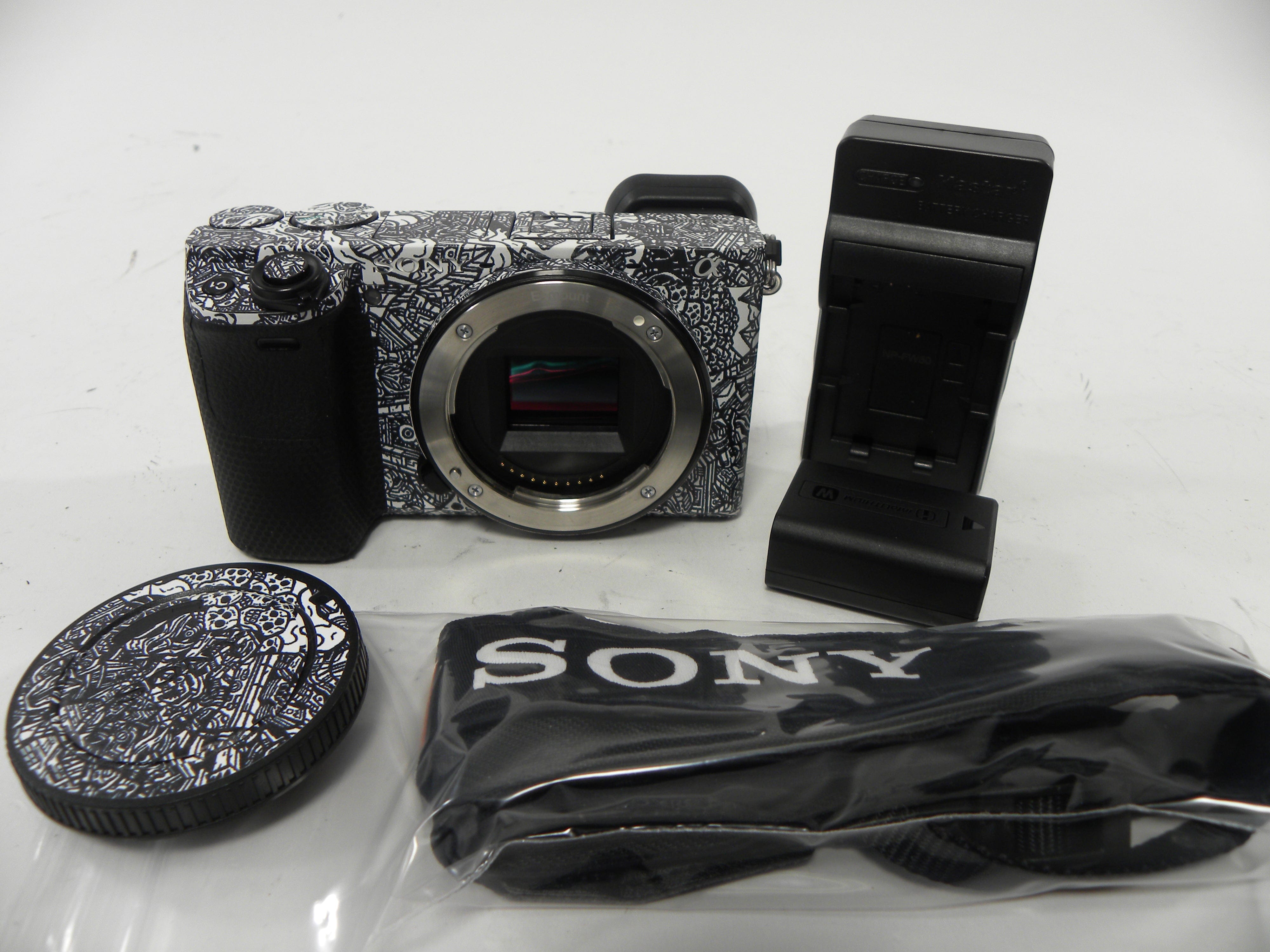 Sony a6400 24.2mp Mirrorless Digital camera Body Only w/Skin Shutter Ct. 5,061